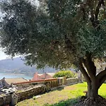 Stone Within Ancient Castle Walls Surrounded By A Lush Garden With Stunning Sea Village And Palmaria Views Sunlit Day Porto Venere