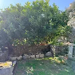 Stone Within Ancient Castle Walls Surrounded By A Lush Garden With Stunning Sea Village And Palmaria Views Sunlit Day * Porto Venere