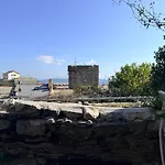 Villa Stone Within Ancient Castle Walls Surrounded By A Lush Garden With Stunning Sea Village And Palmaria Views Sunlit Day