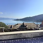 Stone Within Ancient Castle Walls Surrounded By A Lush Garden With Stunning Sea Village And Palmaria Views Sunlit Day *