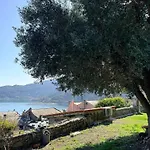 Stone Within Ancient Castle Walls Surrounded By A Lush Garden With Stunning Sea Village And Palmaria Views Sunlit Day ポルトヴェーネレ