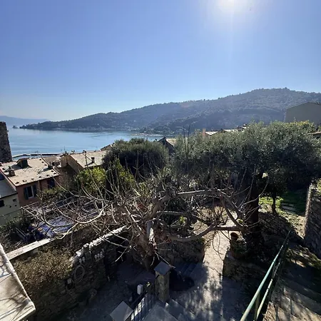 Stone Within Ancient Castle Walls Surrounded By A Lush Garden With Stunning Sea Village And Palmaria Views Sunlit Day *